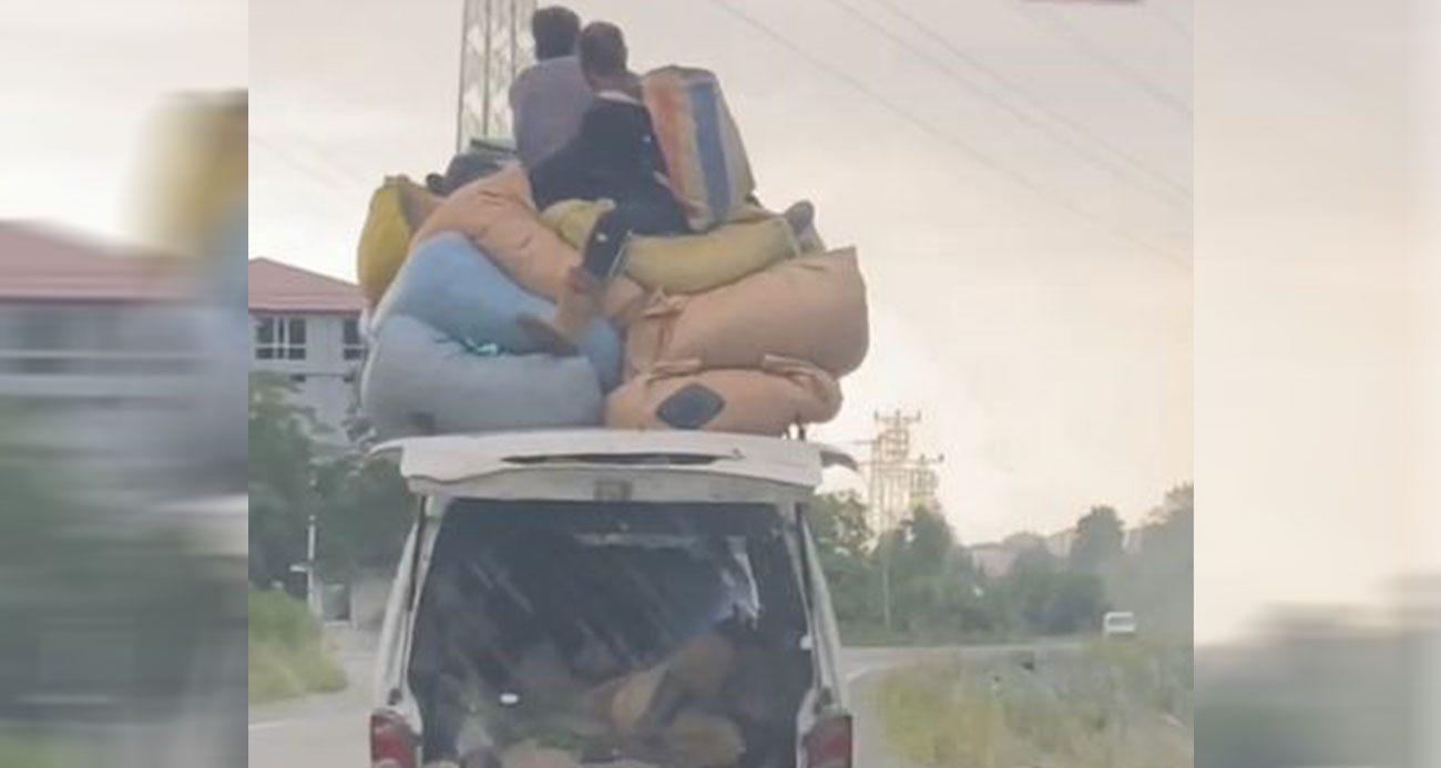 Çay yüklü aracın üzerinde tehlikeli yolculuk