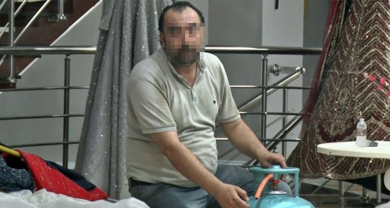Eşinin mağazasına girip gelinliklerin üzerlerine kolonya döktü, tüpe çakmağı dayayınca tazyikli suyu yedi