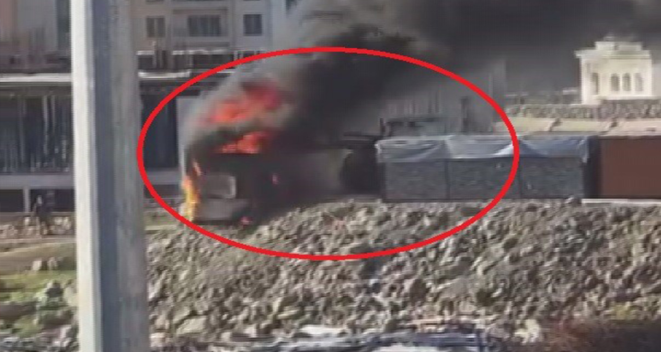 Alevlerin arasına dalan operatör, konteyneri uçurumdan yuvarladı