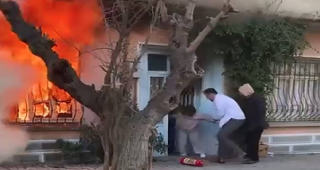 Kedisini kurtarmak için alevlerin içine daldı; komşuları güçlükle dışarı çıkardı