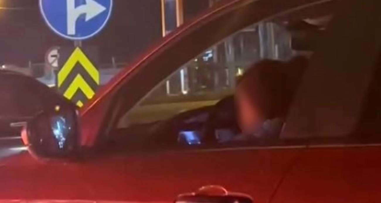 Kucağında çocukla araç kullanan sürücüye tepki yağdı