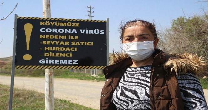 Korona virüs uyarı tabelası dikkate alınmayınca köyü römorkla kapadı