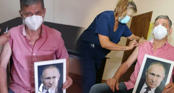 Arjantin&#039;de Roque Perez Belediye Başkanı, elinde Putin portresiyle aşı oldu