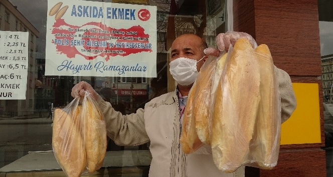 Şehit polis ailelerinden askıda ekmek bağışı