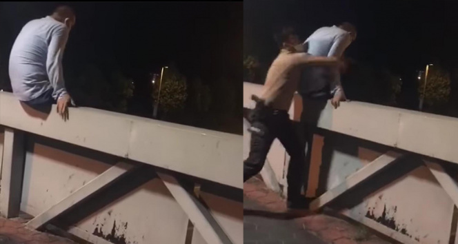 Küçükçekmecede üst geçitte intihara kalkışan vatandaşı bekçiler son anda kurtardı...O anlar kamerada