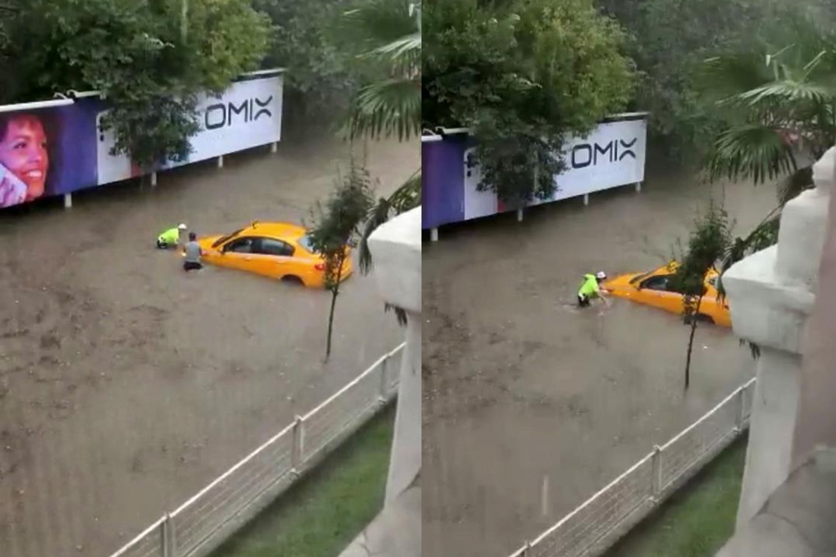 Kahraman Türk polisinin suya girip taksiciyi kurtardığı anlar kamerada