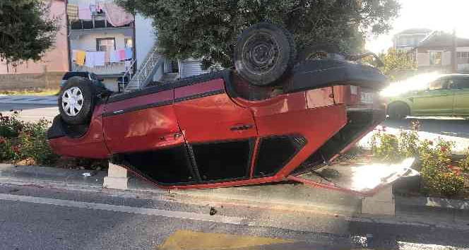Takla atan otomobilden burnu bile kanamadan kurtuldu