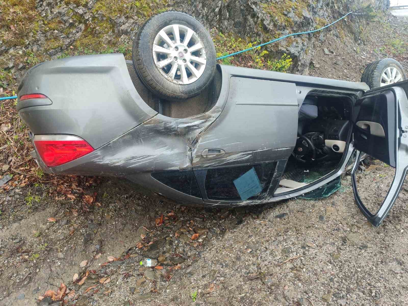 Takla atan otomobilden yara almadan kurtuldu
